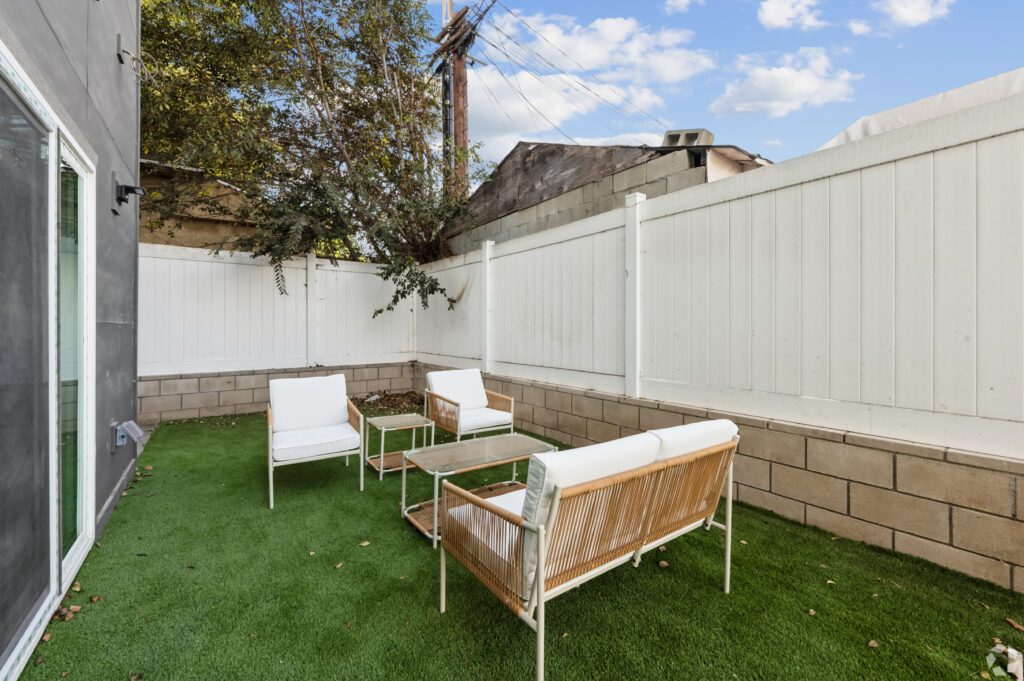 Outdoor lounge area with seating at Nest Housing near USC.