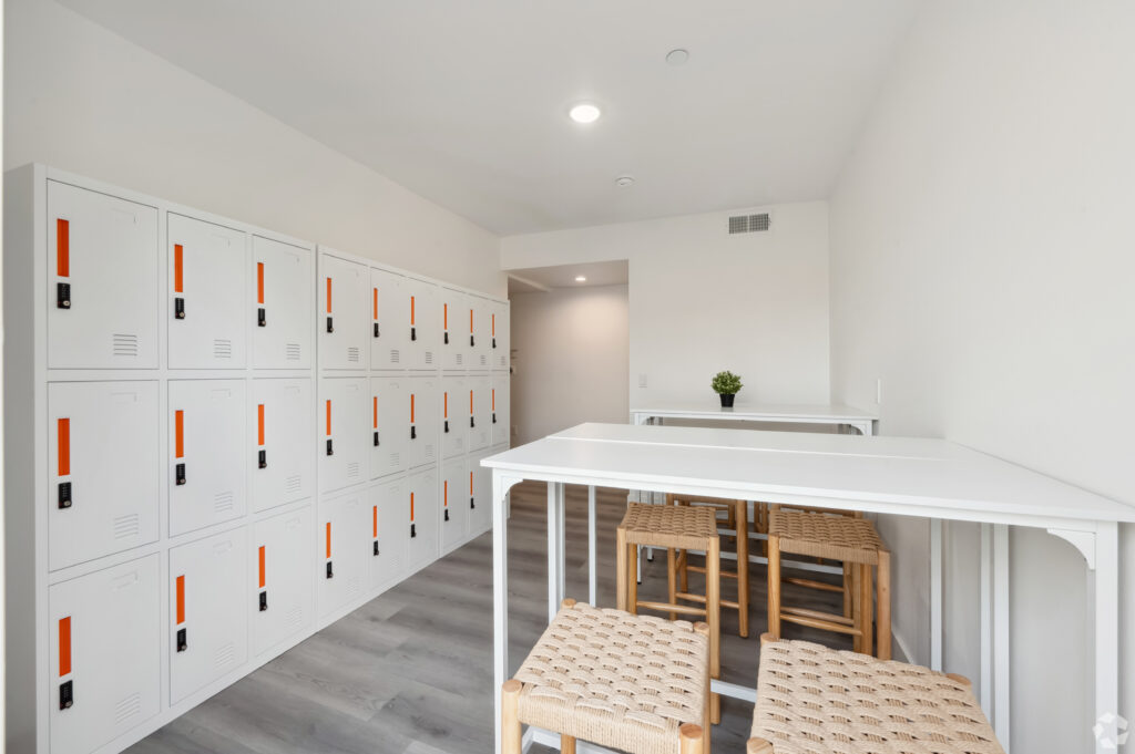 Shared study space with lockers and seating at Nest Housing near USC.