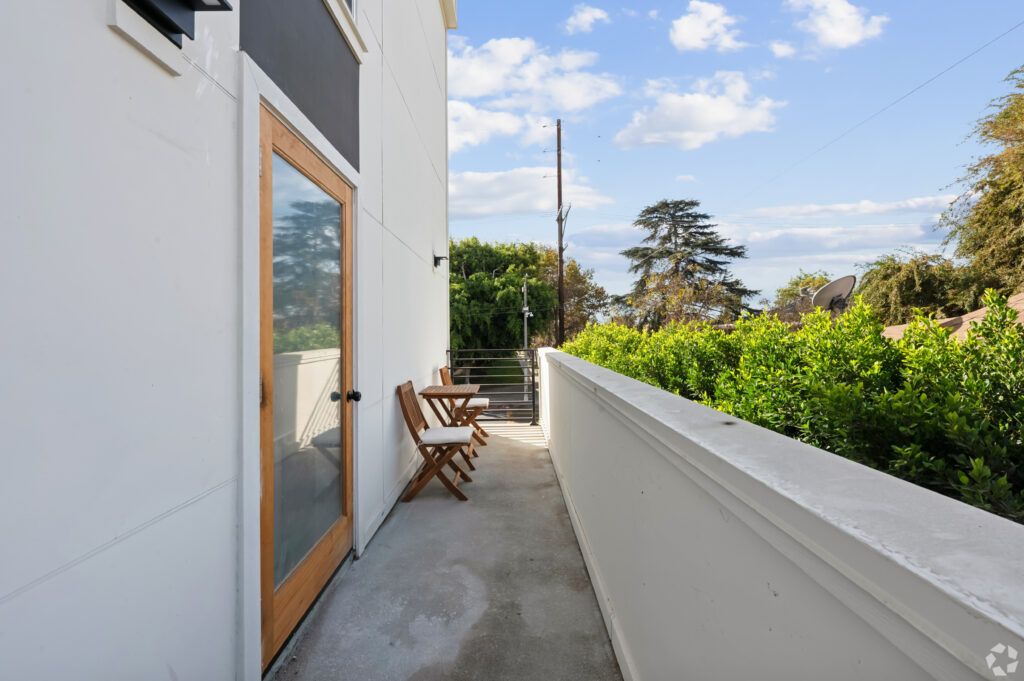 Private balcony with seating at Nest Housing near USC.